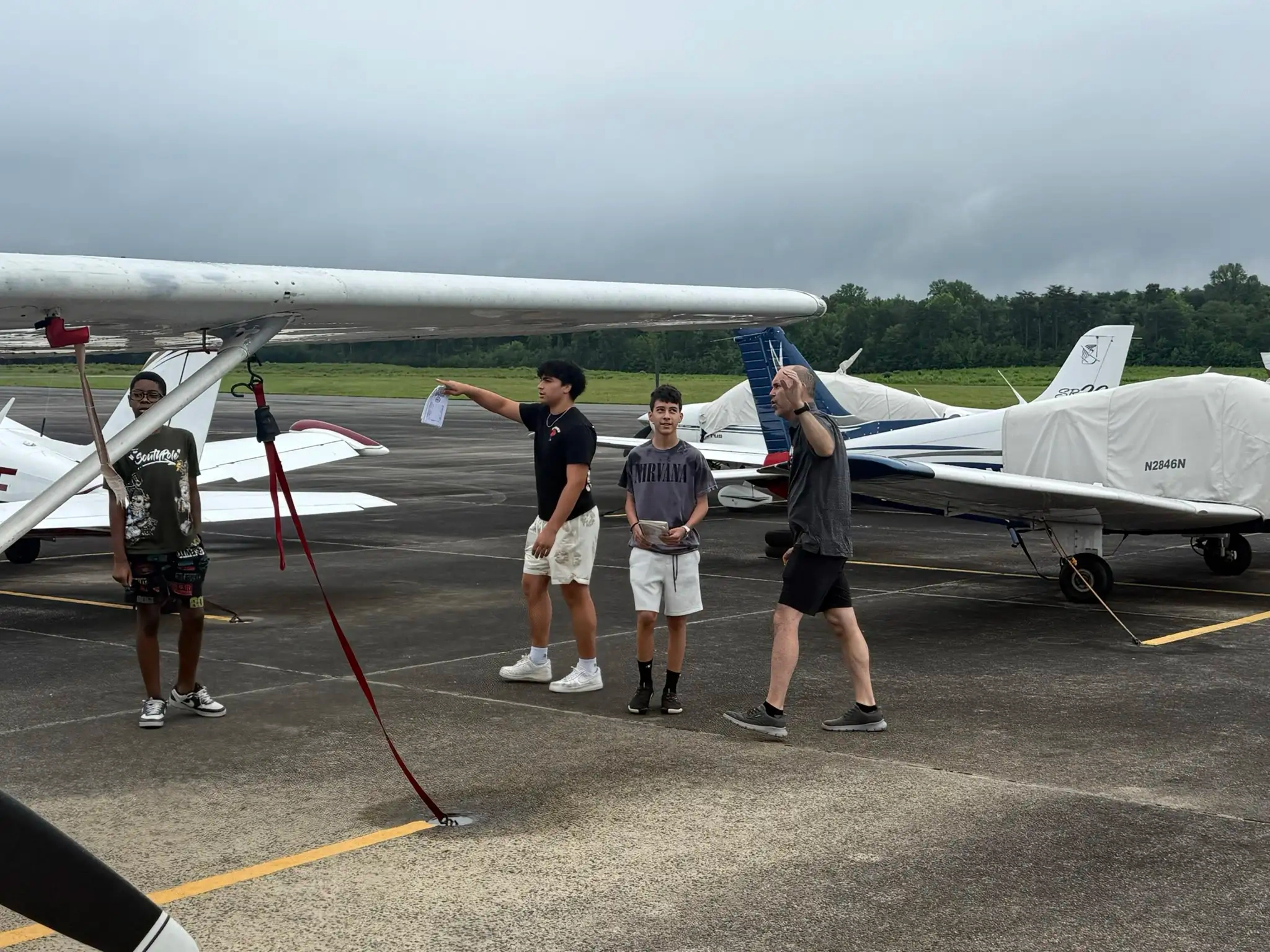 CFI flight instructor demonstrating simulator controls to student at Solid Ground Aviation Fort Meade