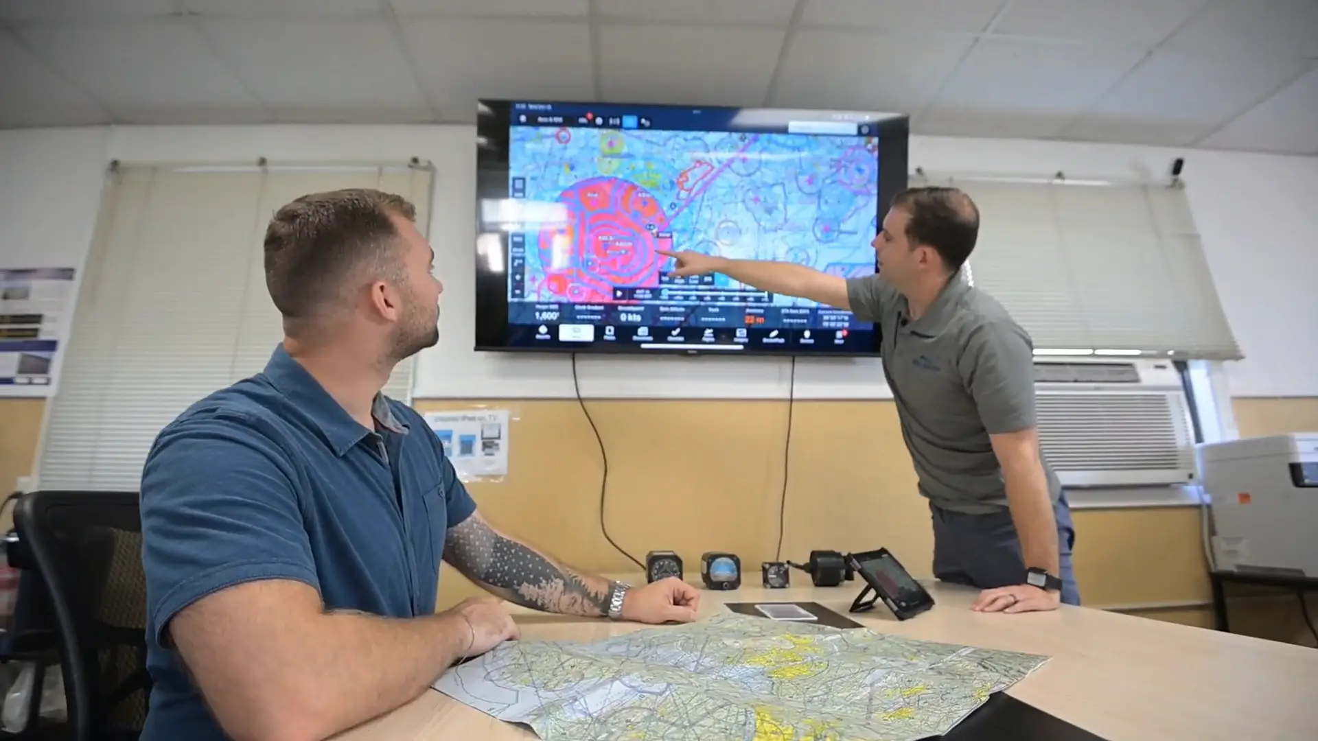 Ground school instructor explaining charts