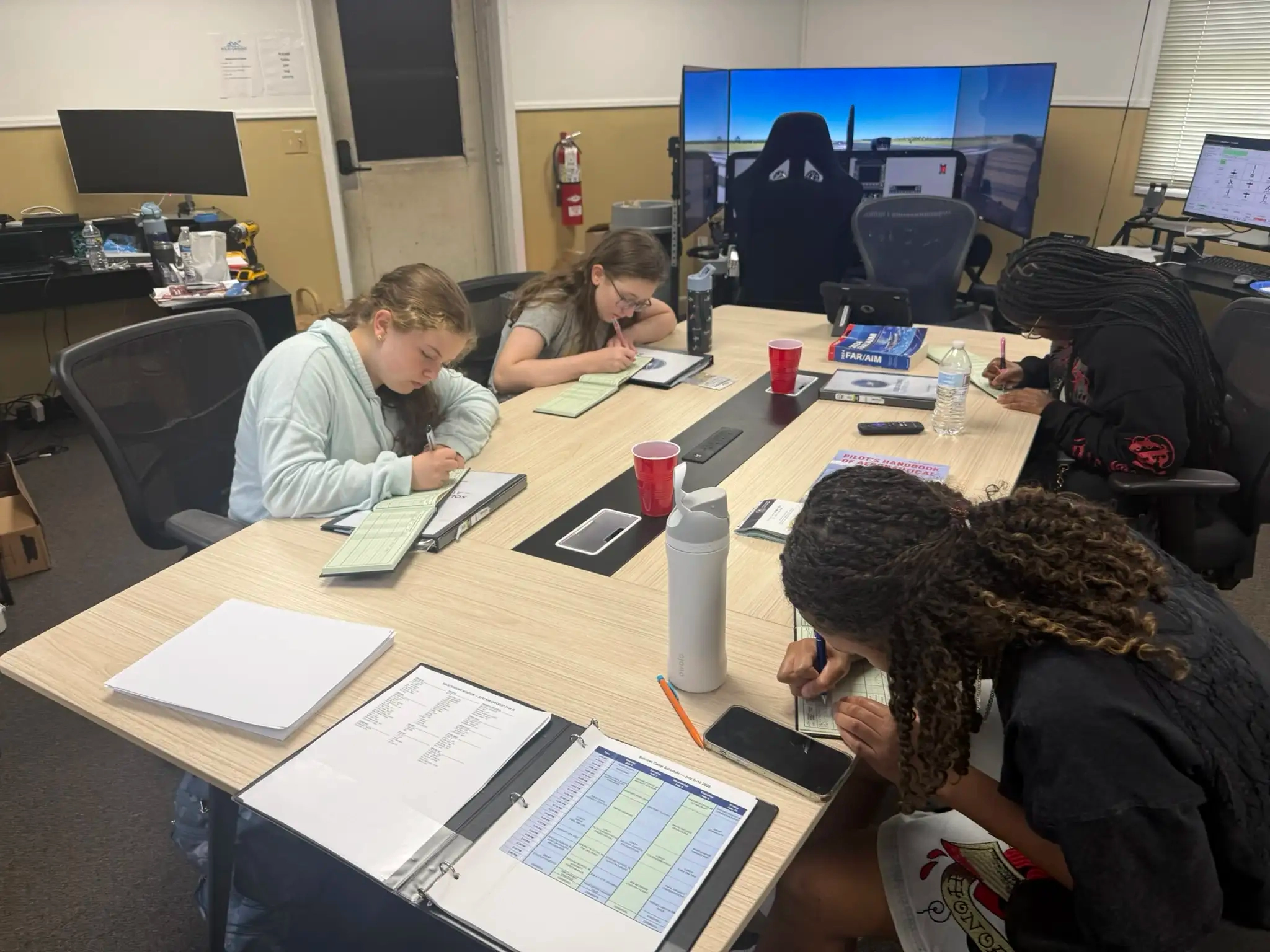 Student pilot studying aviation navigation charts at Solid Ground Maryland