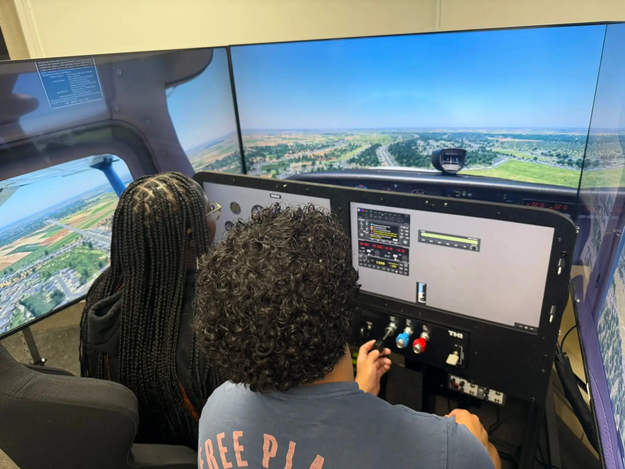 Youth aviation students practicing instrument scan in AATD sim at Solid Ground Aviation Fort Meade