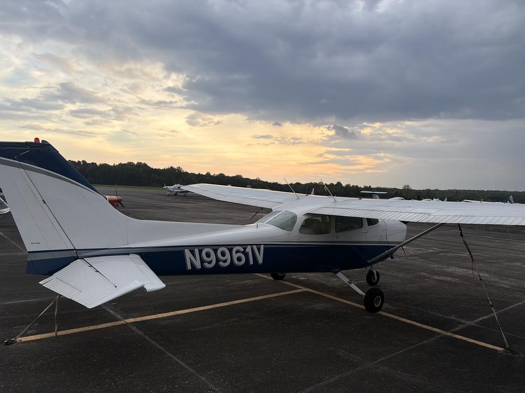 Cessna 172M N9961V parked on the ramp at Solid Ground Aviation at sunset