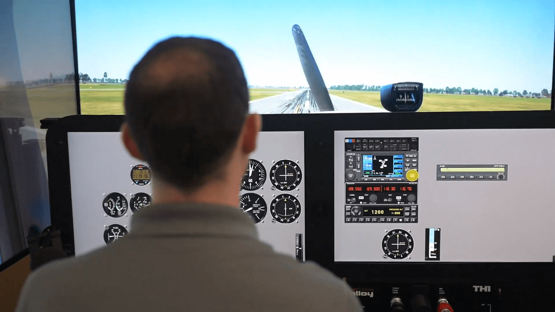Student pilot executing flight maneuvers during a simulator training session