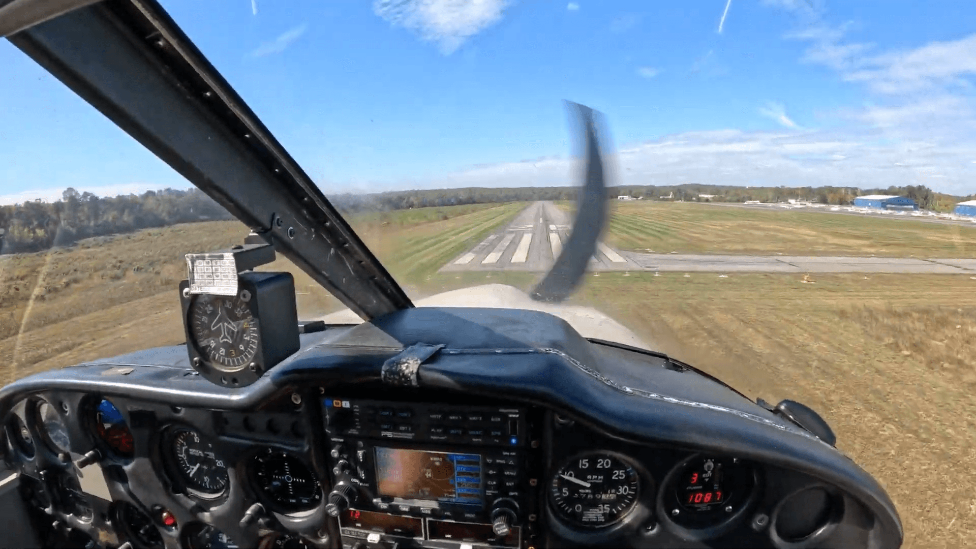 Cockpit view on final approach landing at a runway under controlled airspace