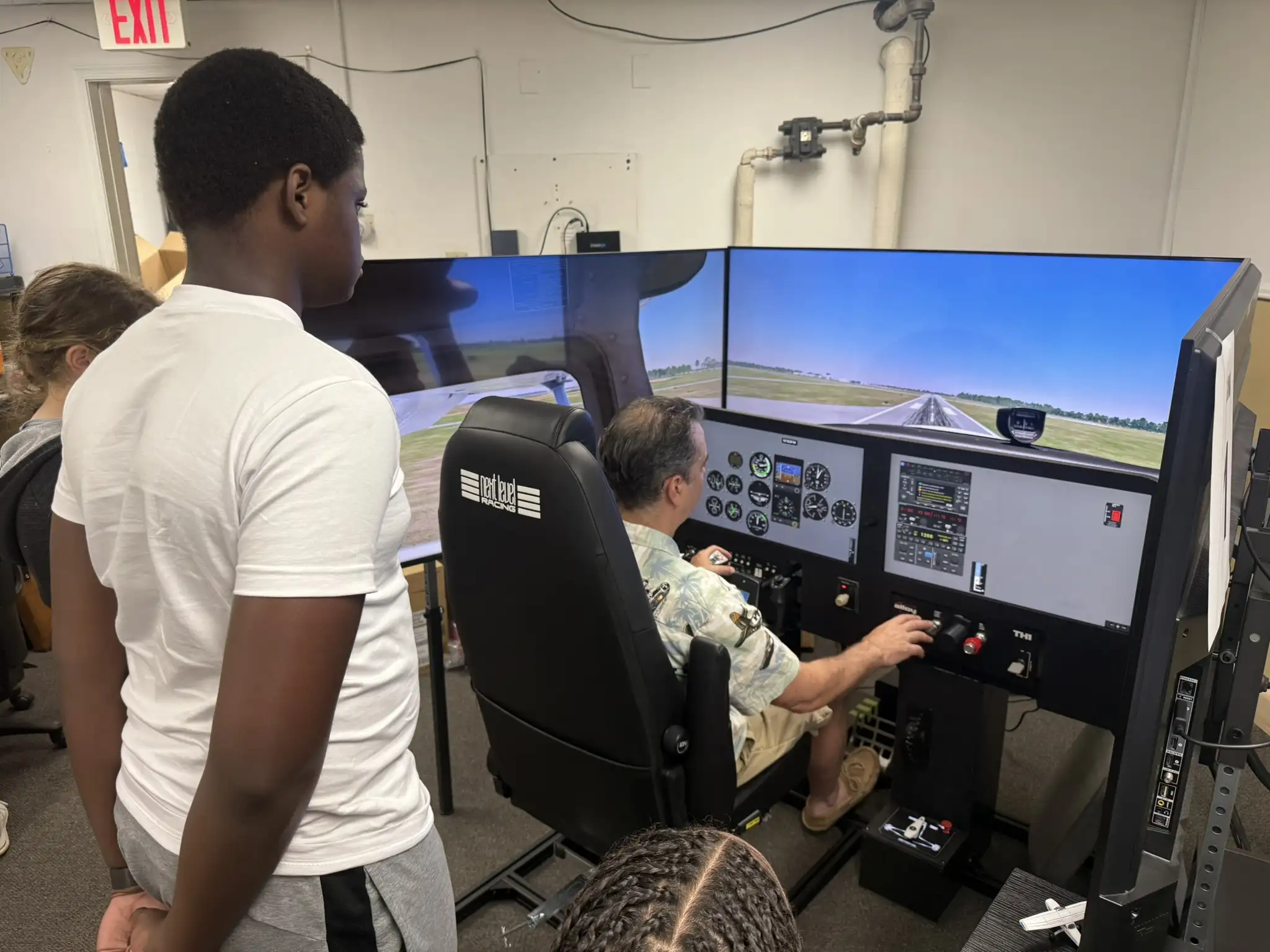 Youth student flying traffic patterns in AATD flight simulator